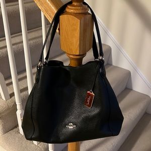 Coach black pebble leather tote gently used